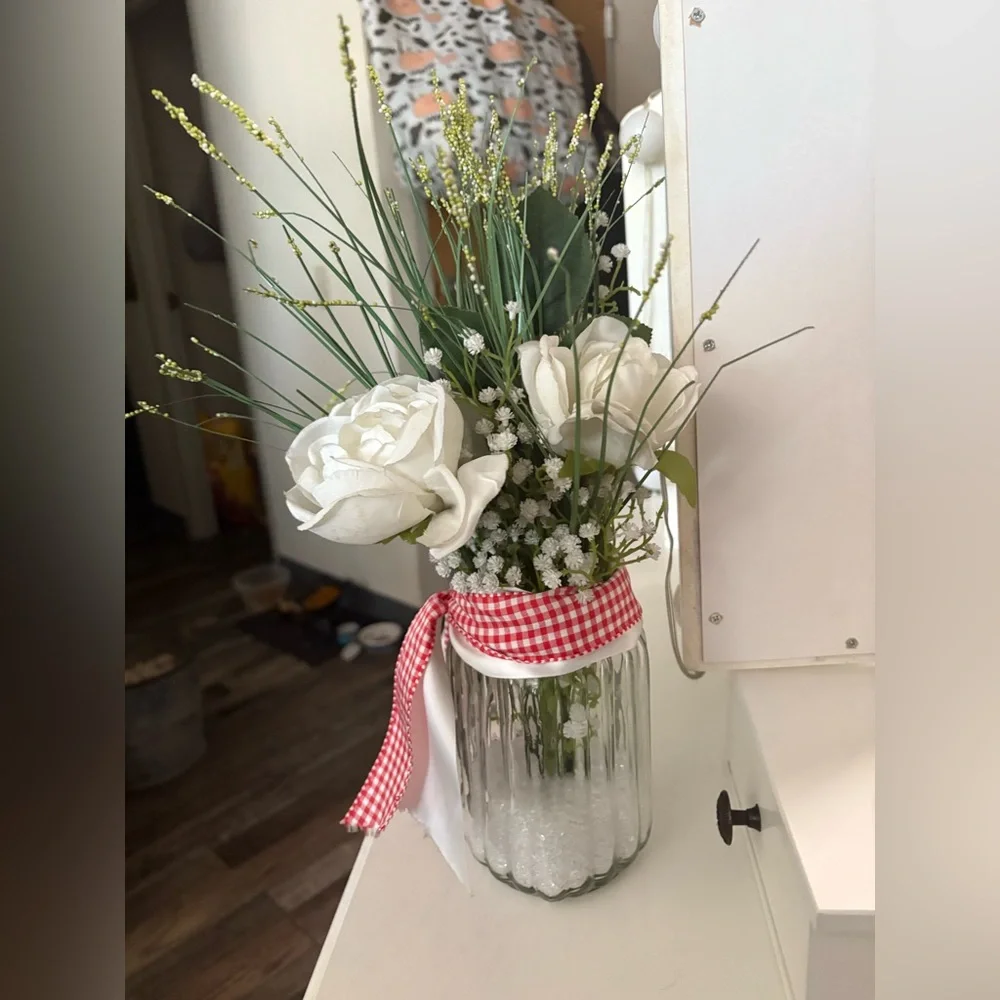 White Floral Arrangement in Glass Jar with Red & White Ribbon